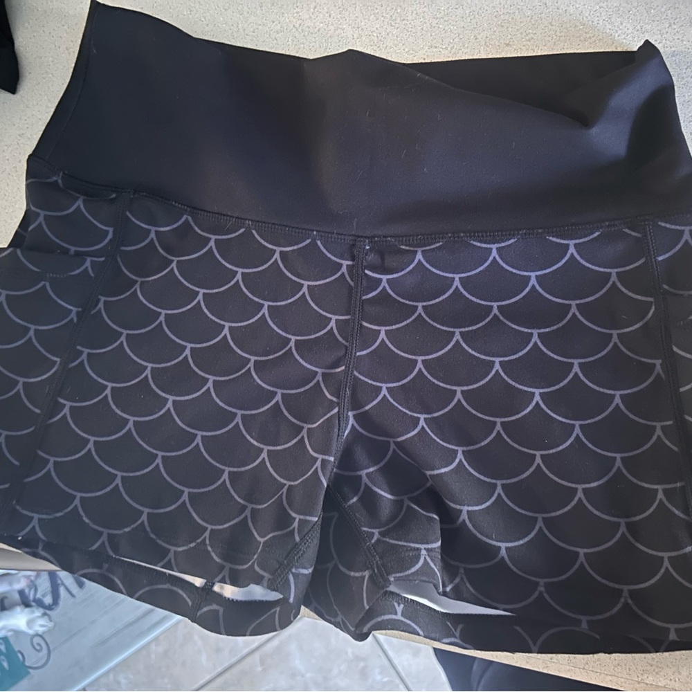 Size medium, 2.5 inch inseam, black scale pattern